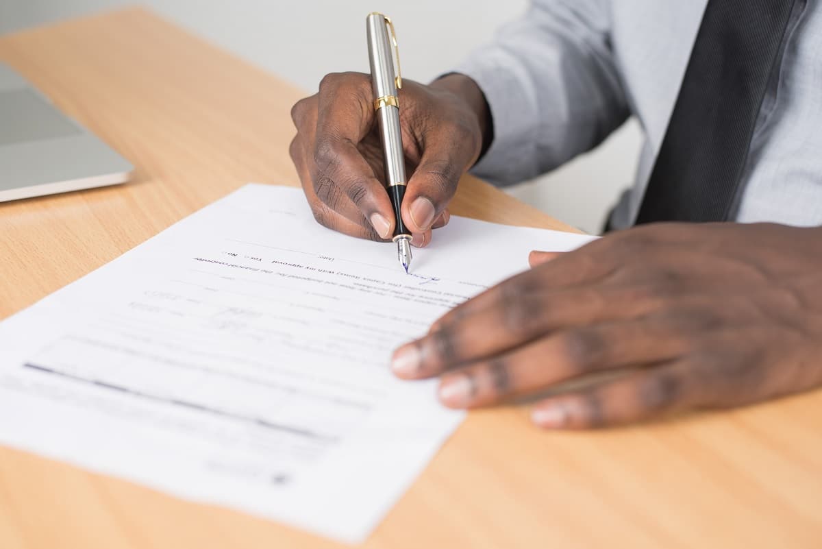 person signing a podcast release form